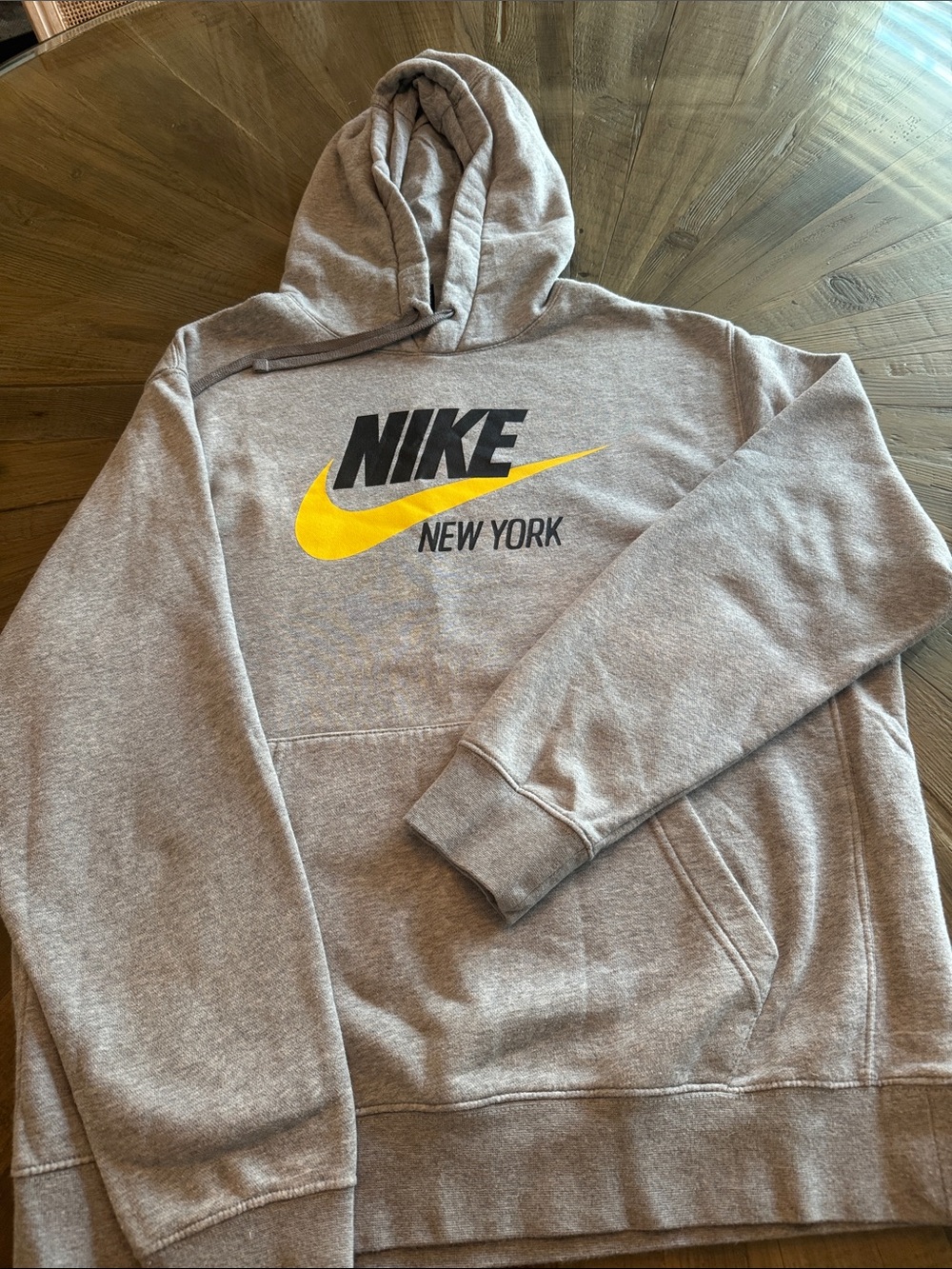 Nike Gray Pullover Hoodie with Yellow Swoosh and Black Text